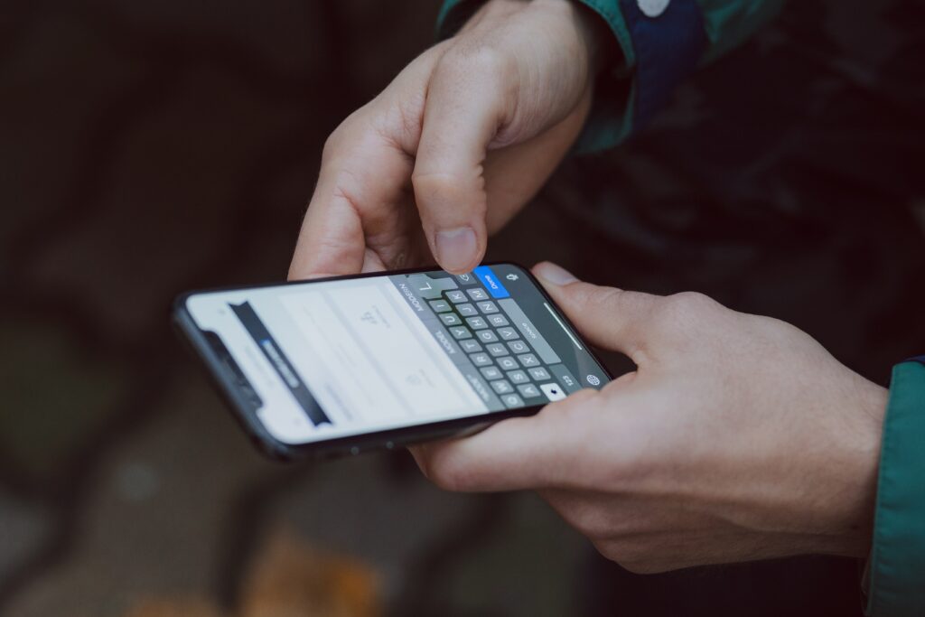 Man holding phone and texting